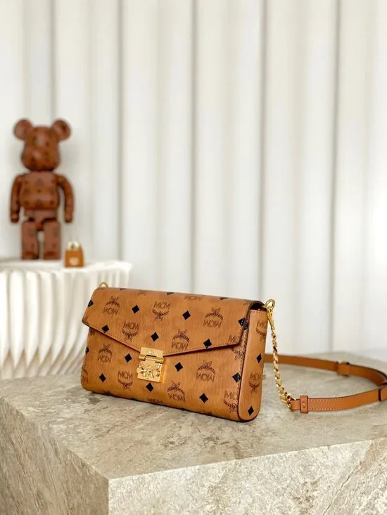 MCM Tan Monogram Clutch with Gold Accent - Picture 6 of 9